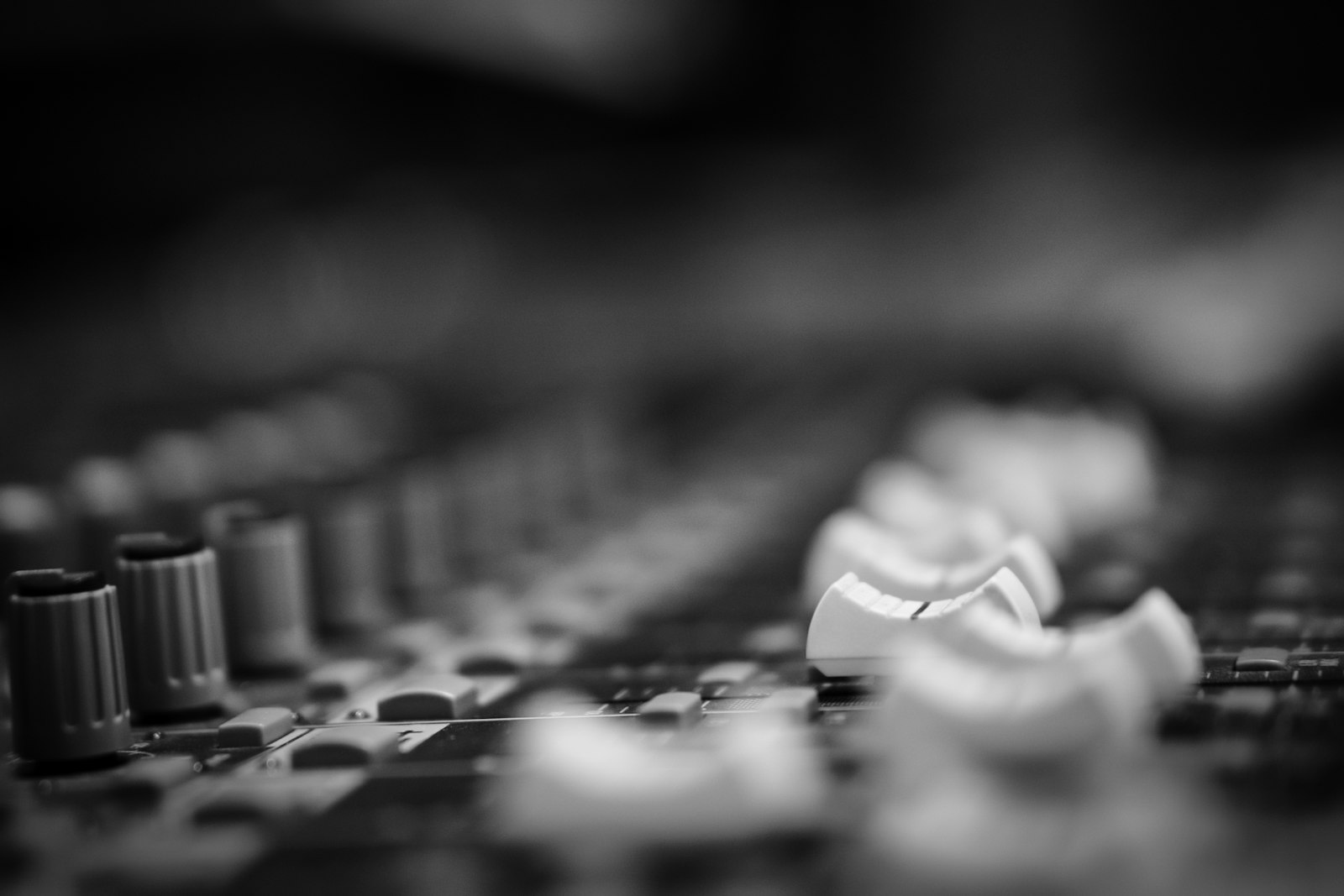 Close-up of a professional recording studio mixing console
